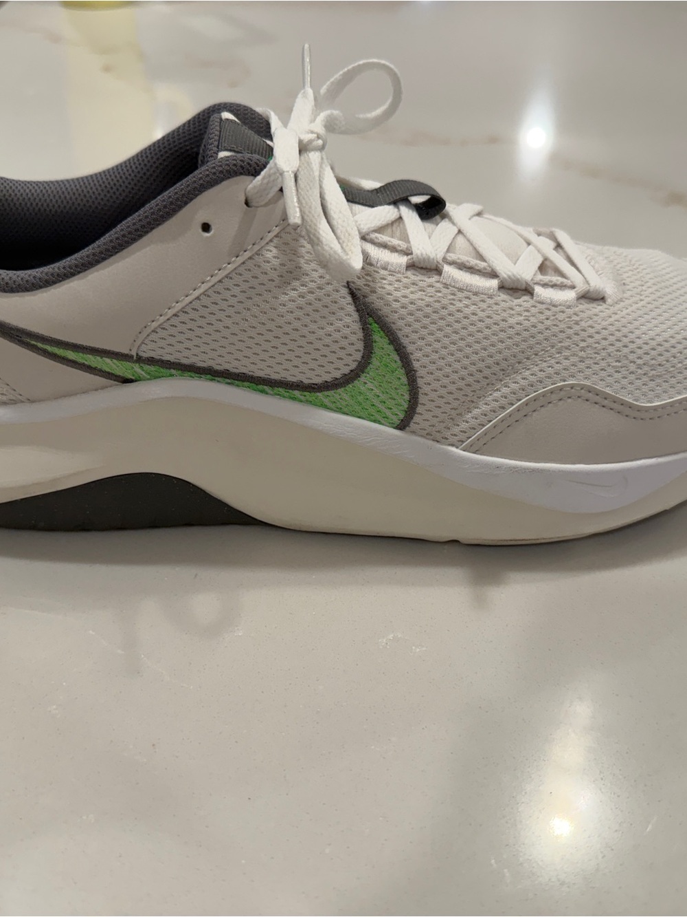 Nike Men’s White Sneaker with Green Swoosh and Gray Lining
